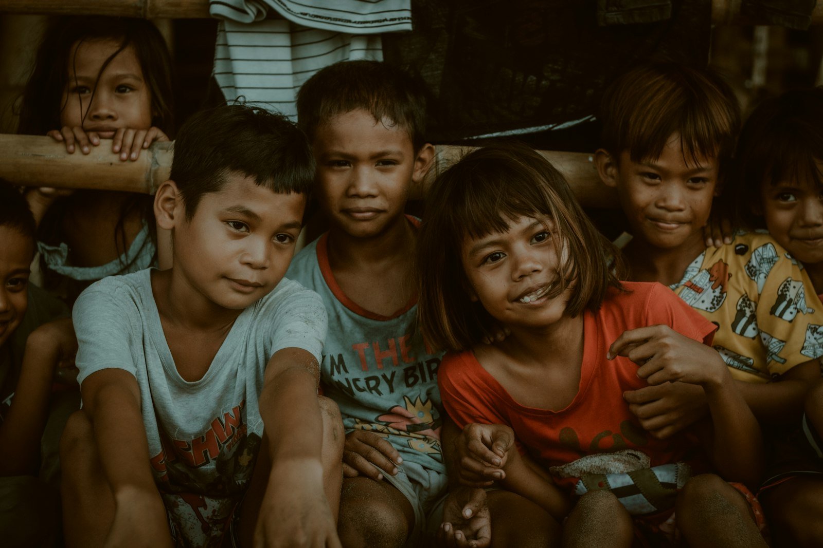 Filipino children sitting together in a community served by a nonprofit — the kind of story good nonprofit website design uses to earn donor trust
